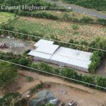 Overview aerial showing the lot and Coastal Highway frontage