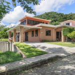 Front and side view with the driveway