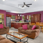 Open living, dining, and kitchen filled with natural light