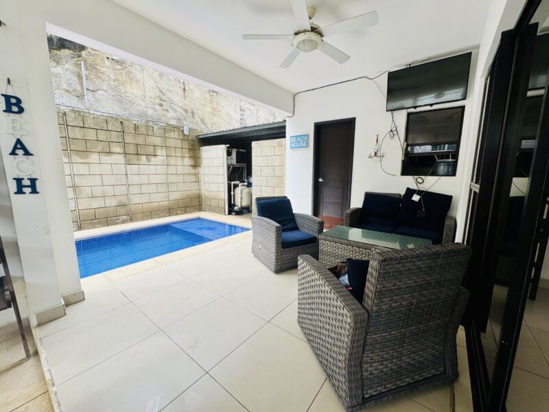 4-bedroom villa with pool in Colinas de Miramar — poolside lounge seating