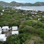 4-bedroom villa with pool in Colinas de Miramar — aerial toward the bay