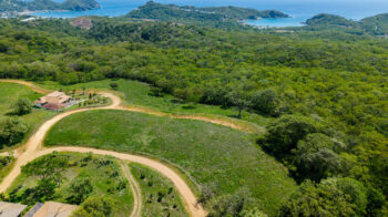 Panoramic ocean view lot near TreeCasa — aerial of the lot with San Juan del Sur Bay beyond
