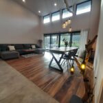 Living room with vaulted ceiling and wood floors