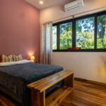 Guest casita bedroom with hardwood floors