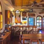 Kitchen with wood cabinetry and bar seating
