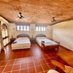 Ocean view home in Pelican Eyes — bedroom with vaulted brick ceiling