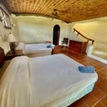 Bedroom with twin beds under a vaulted ceiling