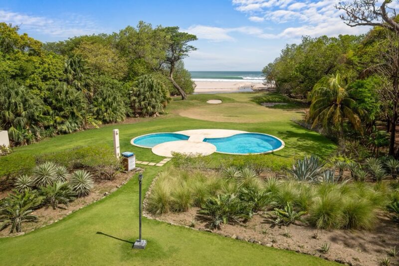 Rio Dulce beachfront villa at Hacienda Iguana — aerial of the pool and beach