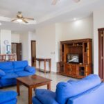 Open living room with ceiling fan and air conditioning