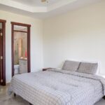 Rio Dulce beachfront villa at Hacienda Iguana — second bedroom with en-suite bath