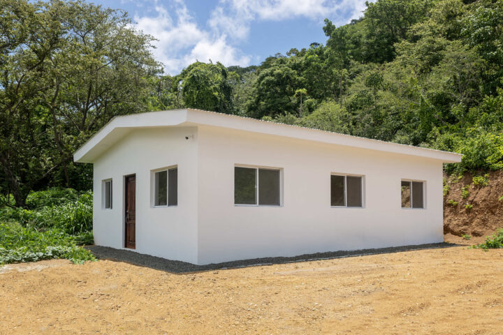 Starter home near Playa Yankee — new single-story house on a hillside lot