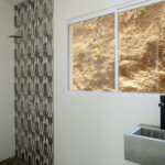 Bathroom with walk-in shower and tiled accent wall