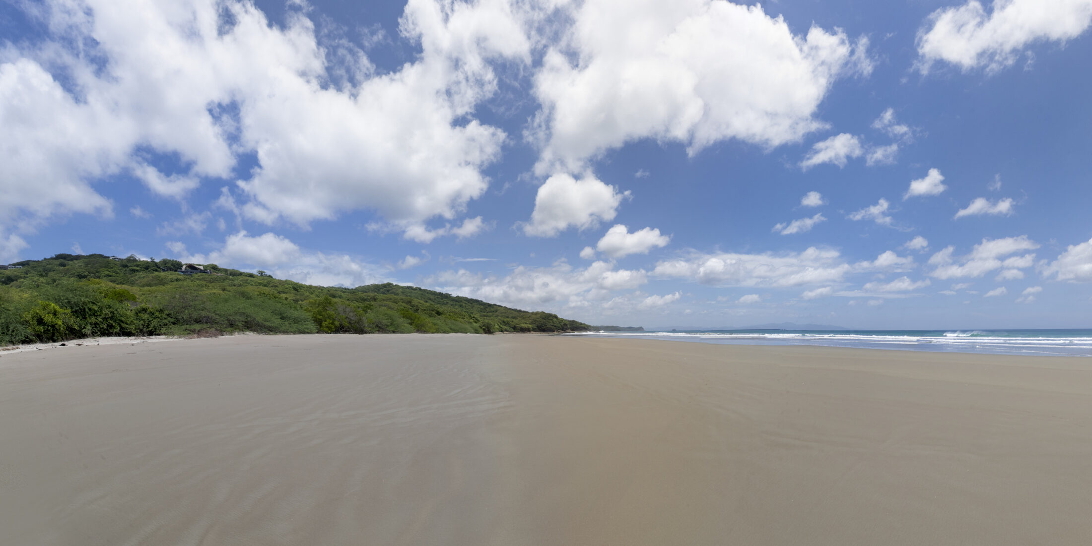 Panoramic view of Playa Yankee beach and headland, San Juan del Sur