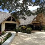 Thatched-roof architecture at TreeCasa, near the ocean view lot