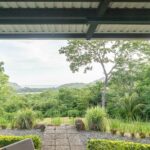 View over San Juan Bay and green farmland from the patio
