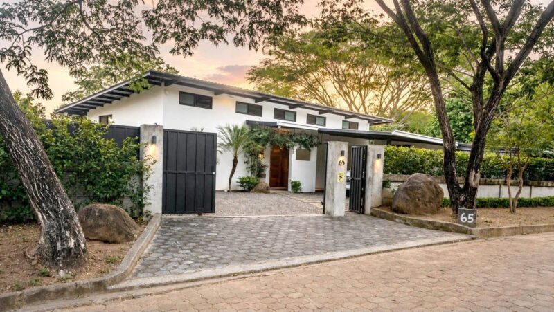 Front entrance and private gate of Lomas de Palermo home at sunset