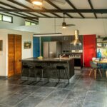 Kitchen with island bar seating and stainless appliances