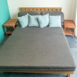 Guest room with daybed and teal accent wall