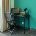 Home office corner with desk and natural light
