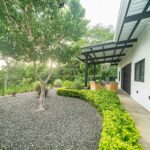 Landscaped gravel garden beside the covered terrace