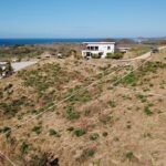Lot boundary outlined on the hillside with the ocean beyond