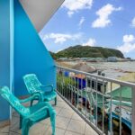 Balcony with chairs looking south over the bay