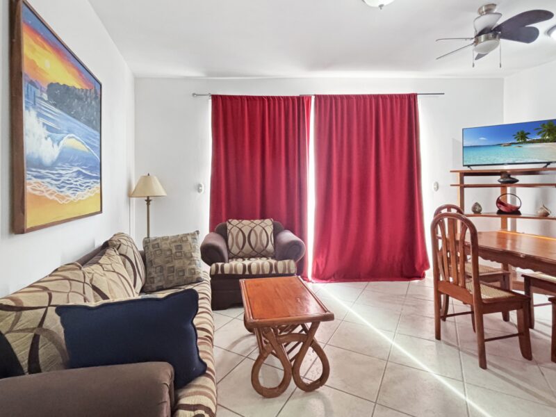 Oceanfront condo at Casa Marina — living room with ceiling fan