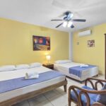Oceanfront condo at Casa Marina — main bedroom with two beds