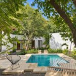 Private pool and terrace surrounded by tropical trees at Hacienda Iguana home