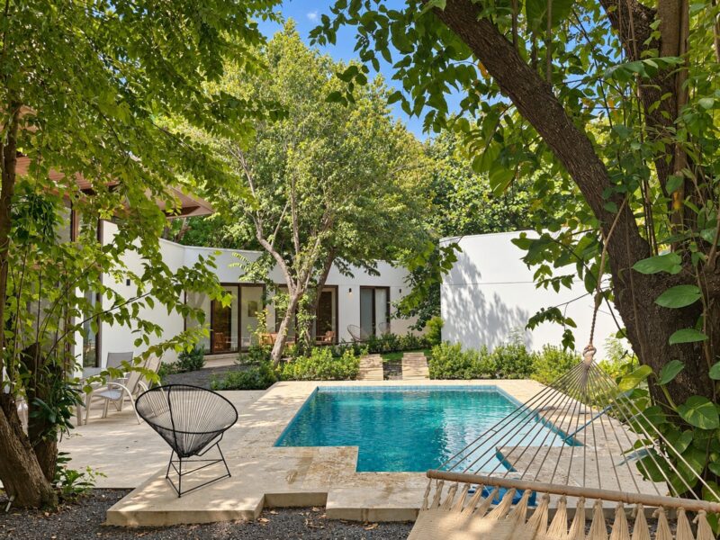 Private pool and terrace surrounded by tropical trees at Hacienda Iguana home