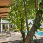 Covered terrace overlooking the pool at Hacienda Iguana home for sale