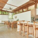 Dining area and kitchen bar seating under wood ceilings, Hacienda Iguana