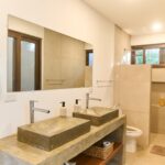 Bathroom with double vessel sinks and walk-in shower, Hacienda Iguana