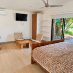 Studio bedroom with sitting area and sliding doors, Hacienda Iguana