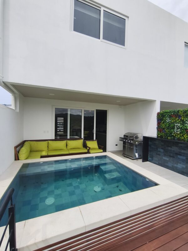 Private pool and wooden deck behind the townhouse