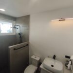 Bathroom with walk-in shower and vessel sink